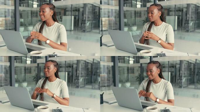 4k视频片段，一个年轻的女商人独自坐在办公室里，用笔记本电脑进行电话会议