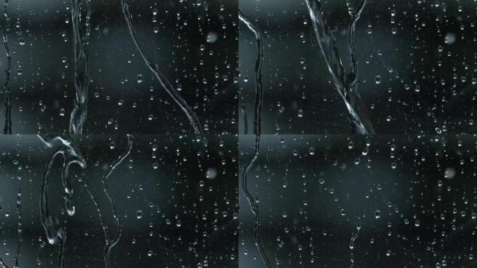 宏观: 透明的雨滴积聚在窗玻璃上，并沿着玻璃流下。