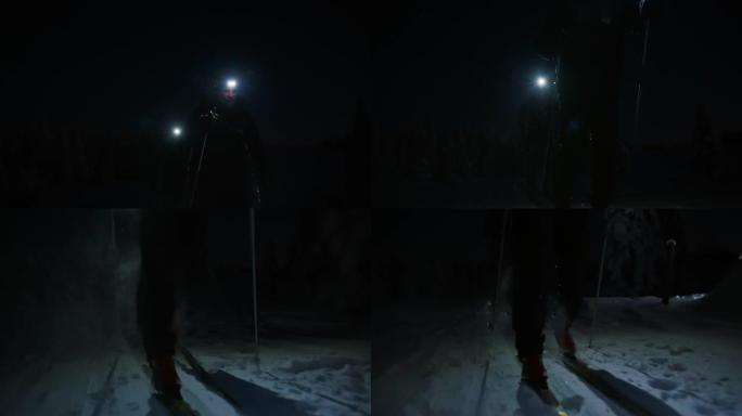 SLO MO两名男子越野滑雪运动员在夜间用大灯滑雪
