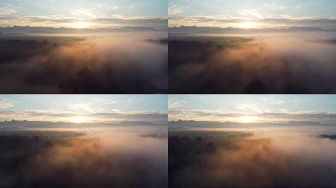 空中拍摄云层和山上的日出