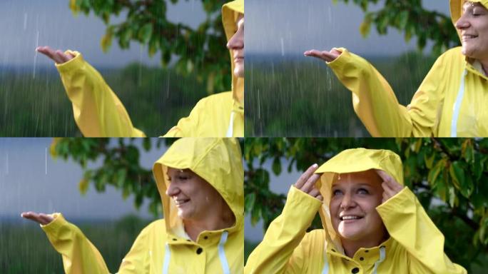穿着雨衣享受雨水的SLO MO女人