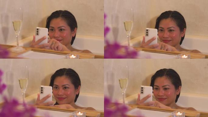 特写: 泡泡浴中的年轻女性为满杯香槟拍照