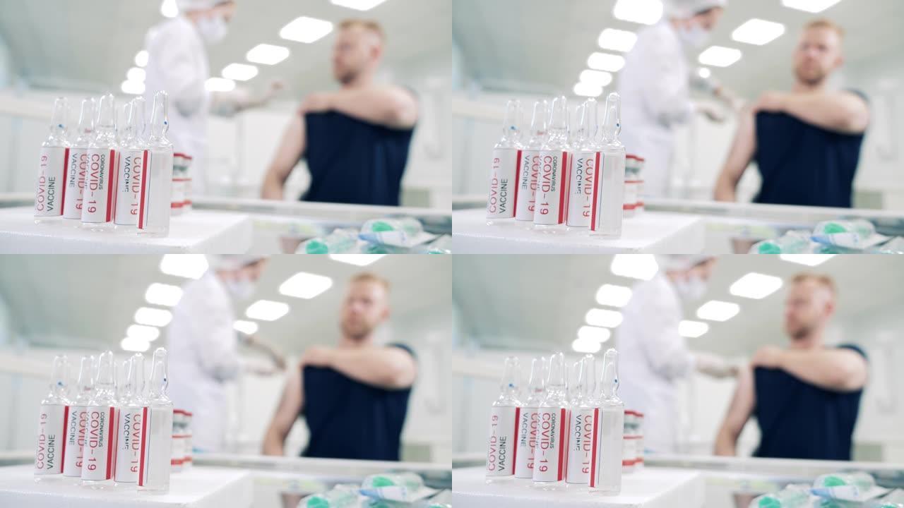 新型冠状病毒肺炎疫苗和一名男子接种疫苗