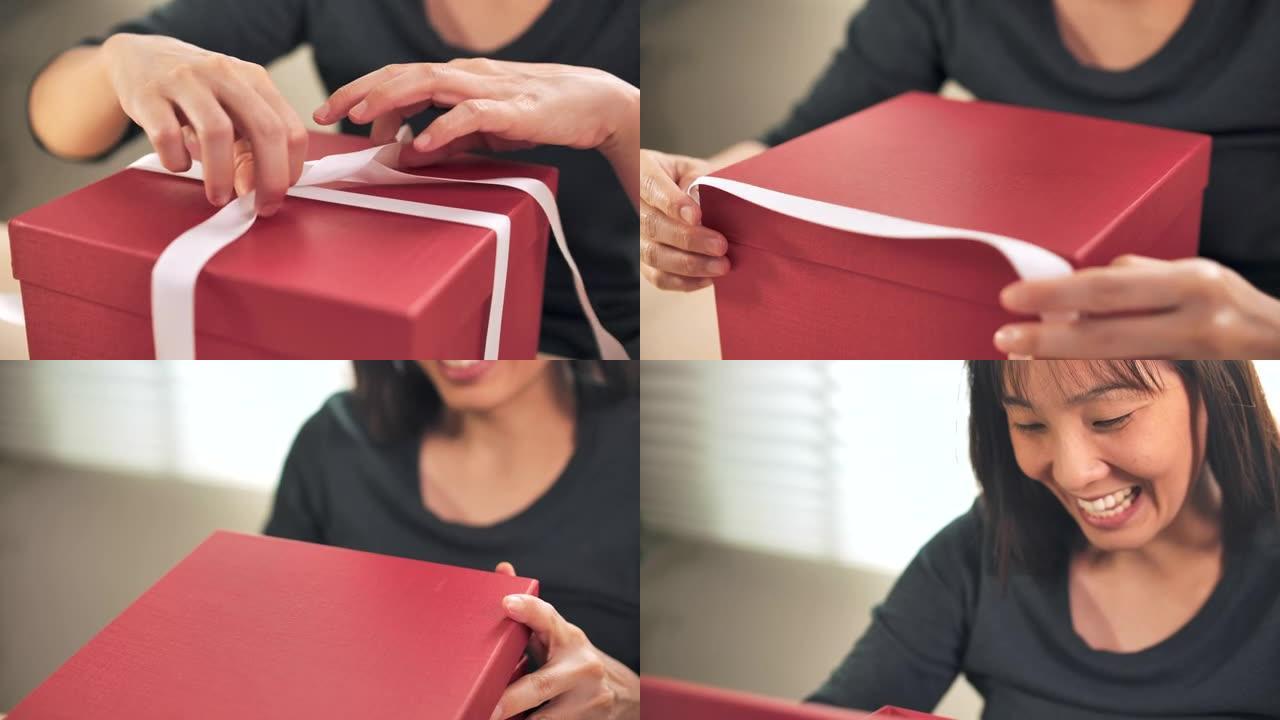 特写慢动作亚洲女性打开礼品盒