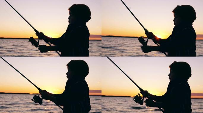 小孩在日落时钓鱼时正在处理钓鱼竿