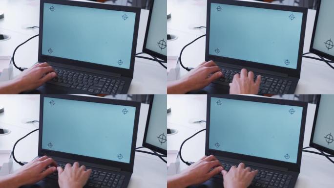 白人女商人在办公室的办公桌上使用笔记本电脑的手