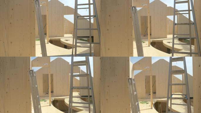 特写: 铝制梯子散落在正在建造的小屋中。