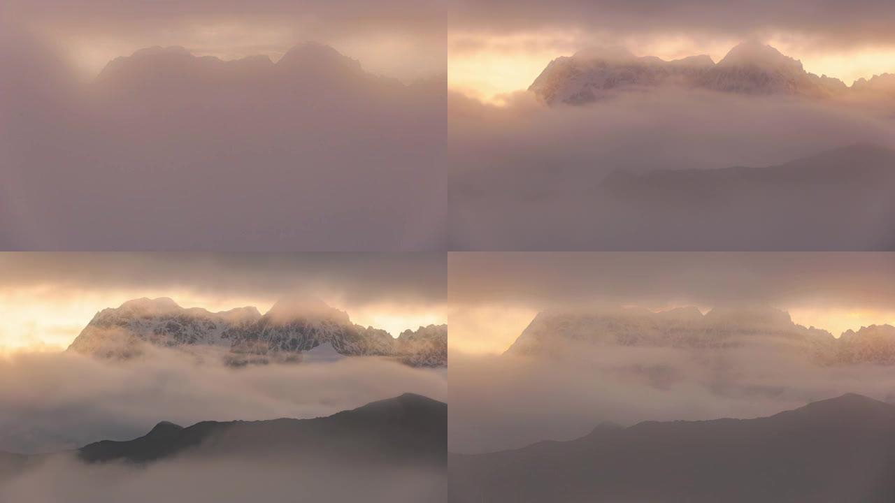 云层散布了裂缝，在日出时看到了梦幻般的山脉