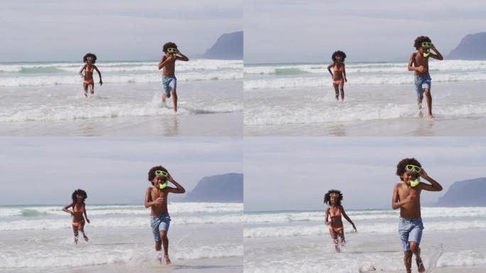 戴着水肺护目镜的非洲裔美国儿童在海滩上玩耍