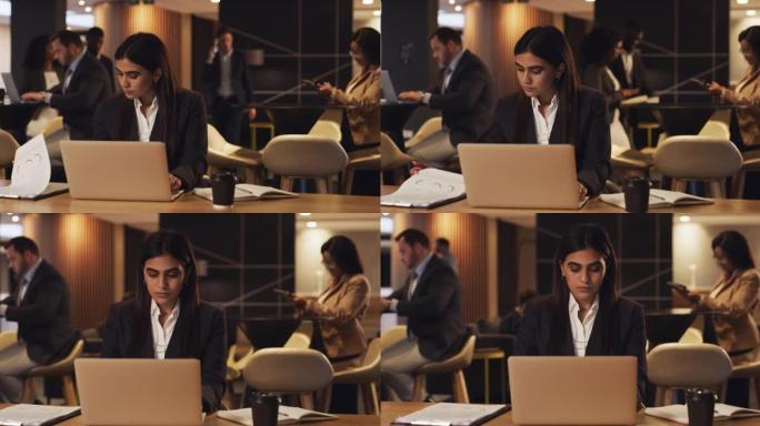 4k视频片段，一名年轻的女商人在会议休息室的笔记本电脑上工作