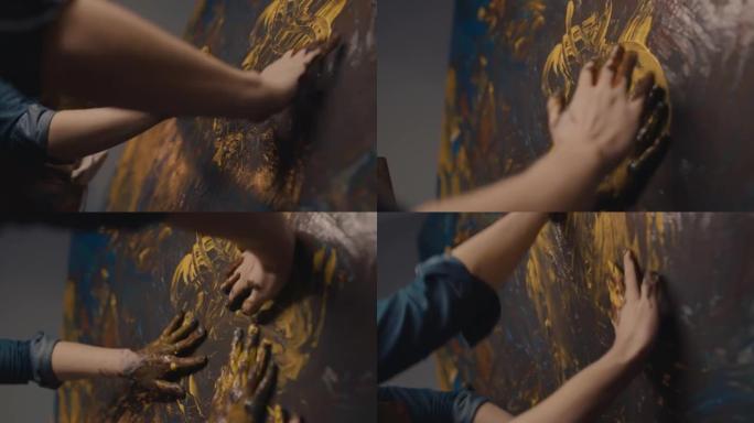 SLO MO才华横溢的艺术家夫妇用手在画布上画画