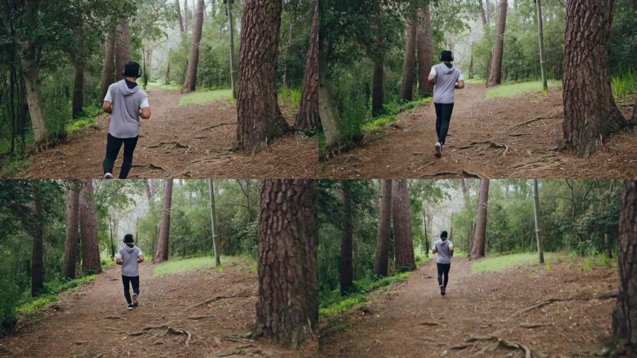 跑步，健身和运动的人在耳机上听音乐，并在森林或树林中训练。与男性运动员或跑步者一起跑步锻炼，健康和健