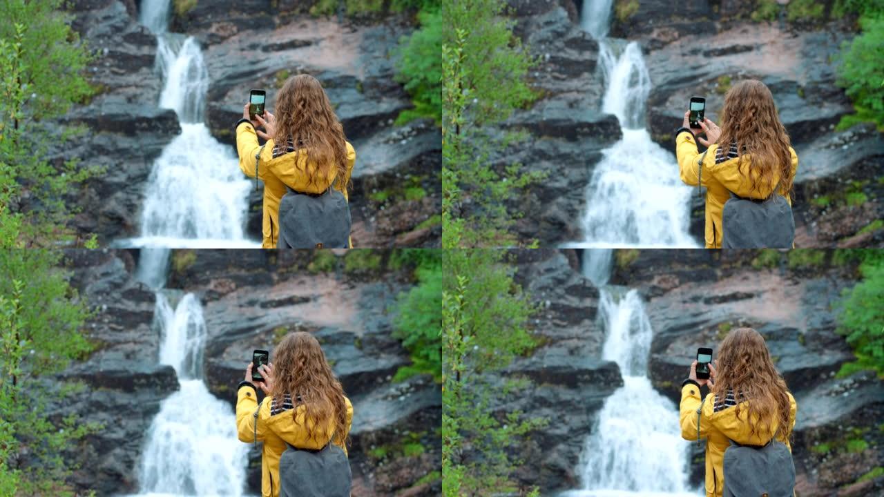 4k视频片段，一个无法识别的女人在喷泉上拍照