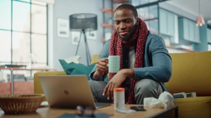 生病和疲倦的黑人非洲裔美国人打电话到办公室，用舒适的客厅的笔记本电脑上的视频通话。生病和恶心的男性穿