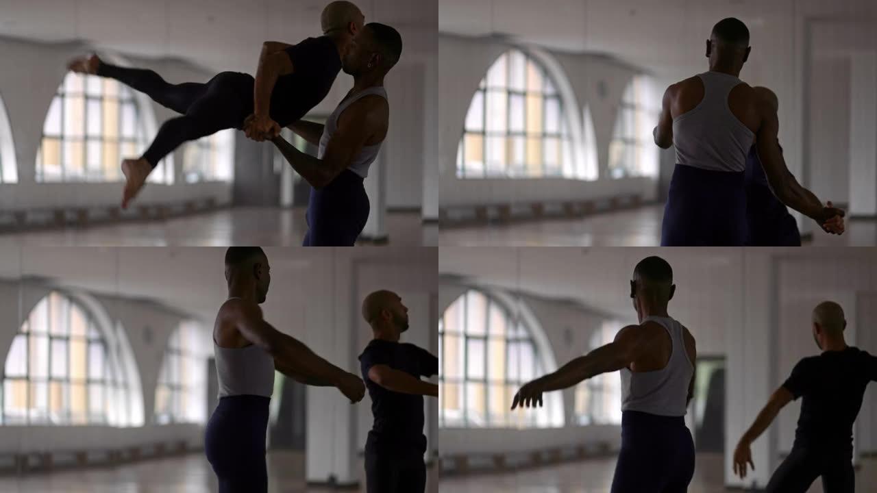 两名男舞者在舞蹈工作室一起表演芭蕾舞
