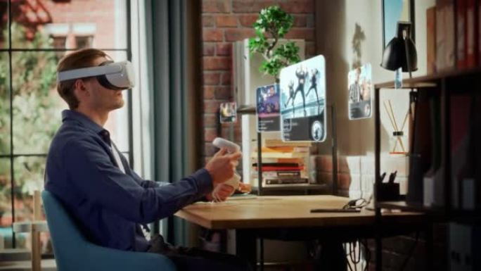 现代成功的男人坐在家里的客厅，使用带有控制器的虚拟现实耳机检查社交媒体应用程序。年轻男性选择观看舞蹈