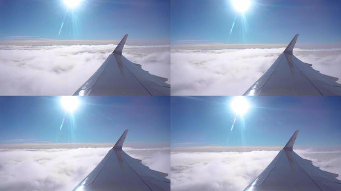 从飞机窗口俯瞰美丽的日出或日落。美丽的云层形成了飞机的窗户。旅游概念。