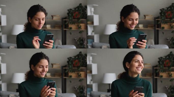 微笑年轻迷人的白人妇女使用智能手机。