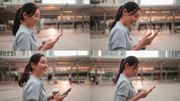亚洲女子在城市中行走并使用智能手机