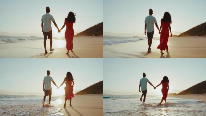 海滩上的日落漫步浪漫度蜜月小情侣海边