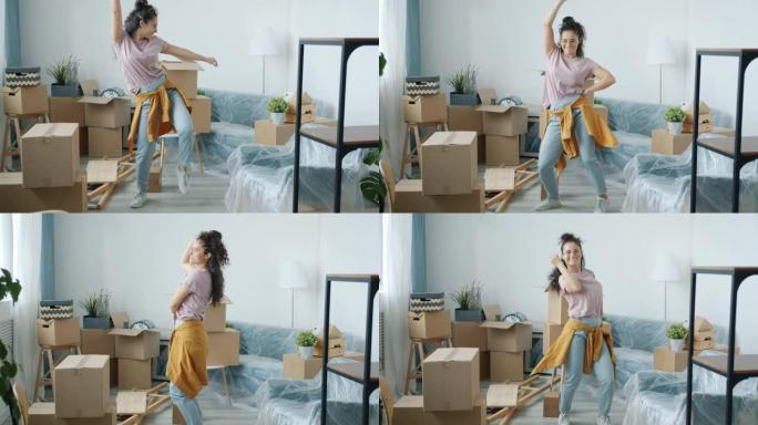 搬迁期间，快乐的混血女人在新的现代公寓里跳舞
