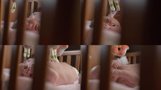 SLO MO婴儿男孩躺在婴儿床中