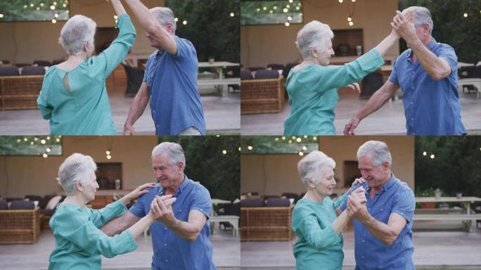 高年级白人夫妇在花园里跳舞和微笑