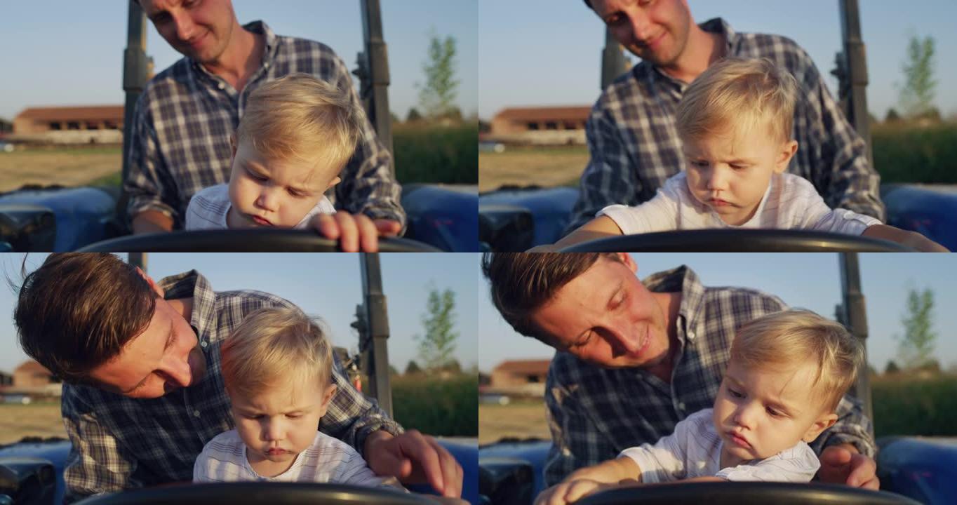 快乐农民父亲的真实镜头正和他的小儿子开着拖拉机，在阳光明媚的日子里展示了家庭农业财产。概念: 农业、