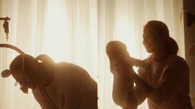 母亲在黑暗的房间里从婴儿床里捡起一个可爱的新生男婴的垂直格式视频。妈妈从床上抱起幼儿。童年、新生活、