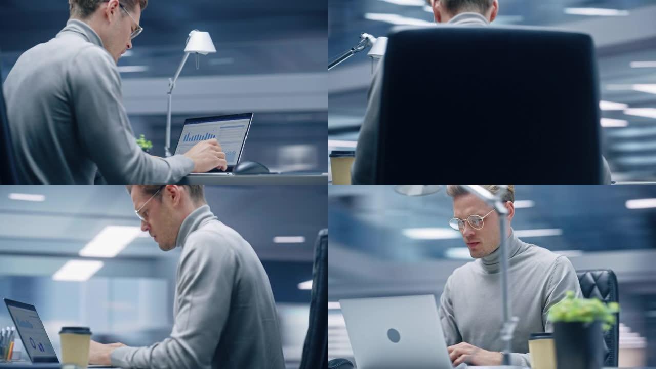 360学位办公室: 英俊的商人坐在办公桌前使用笔记本电脑。与大数据数字电子商务项目统计合作的数字企业