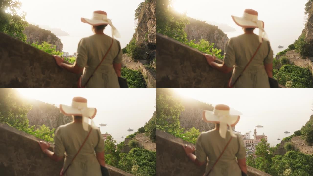 Woman looking at the view of the village of Atrani