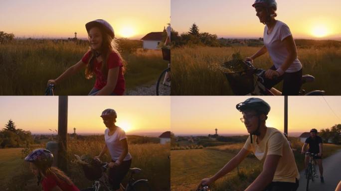 SLO MO一家有三个孩子在日落时在乡下骑自行车