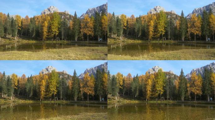 风景秀丽的意大利阿尔卑斯山的高耸山峰俯瞰着宁静的Lago d'antorno