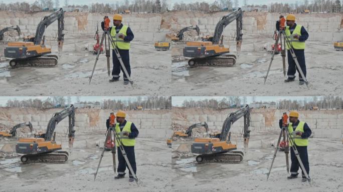 阿拉伯男子在采石场使用测量设备