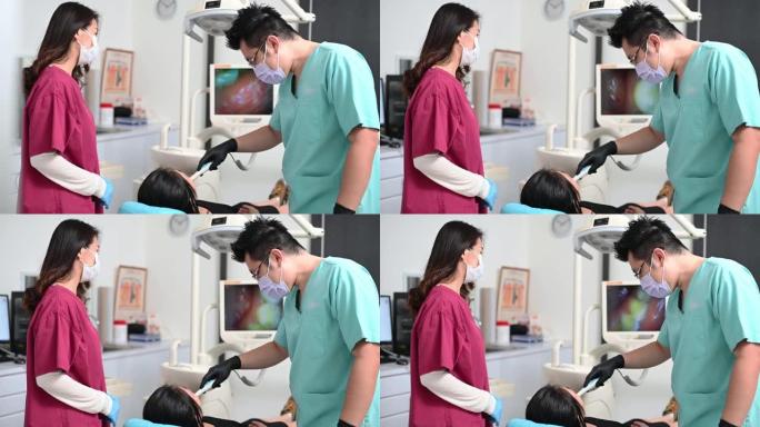 亚洲华人牙医在诊所护士的帮助下为患者进行手术