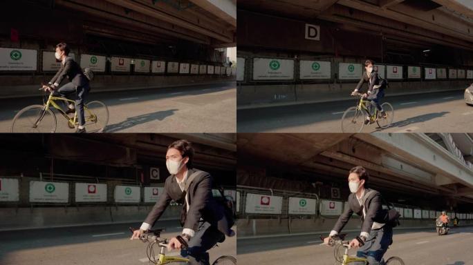 商人在城市骑自行车时戴着外科口罩。