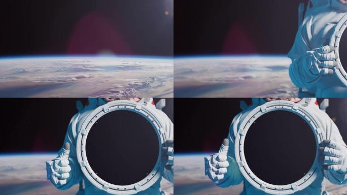 零重力的宇航员的特写镜头举着圆形标志，并显示出竖起大拇指的手势。
