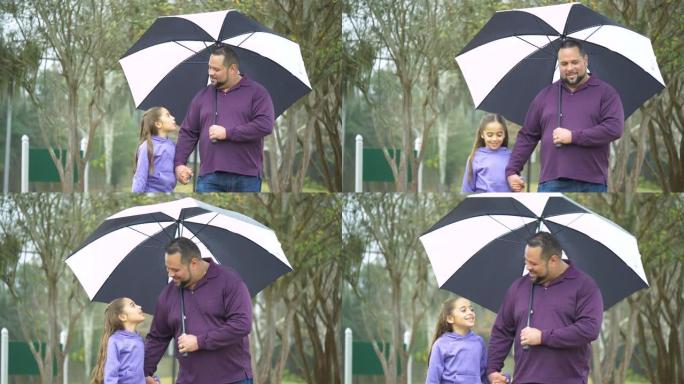 西班牙裔女孩，父亲在雨天在雨伞下行走