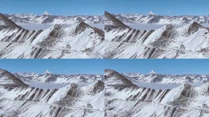 神奇的冬季雪山空中景观嘉金山四女山在中国四川蜿蜒的道路