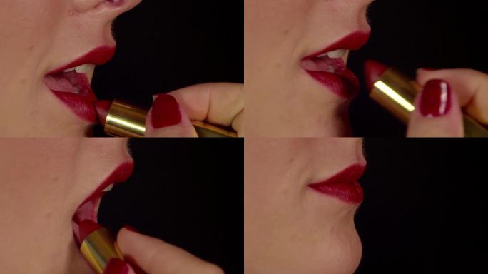 慢动作特写: 女人在嘴唇上涂上红色唇膏