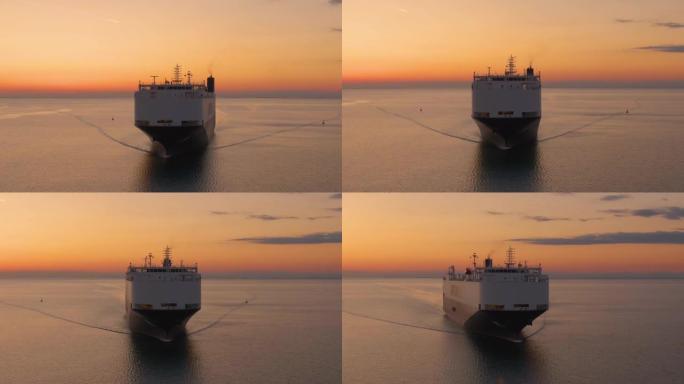 空中: 日落时运输商品的货运船的无人机拍摄。