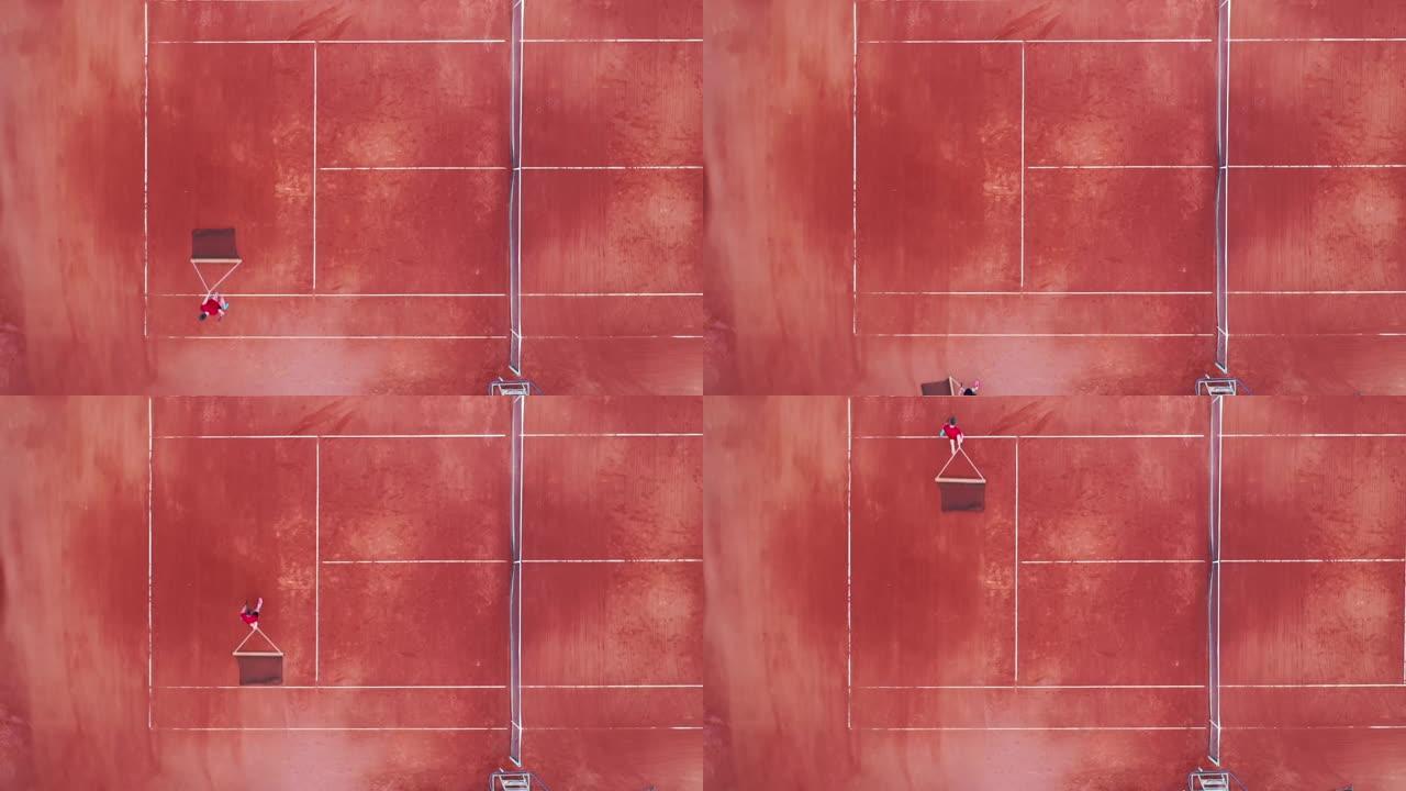 一名男子正以俯视图的方式穿过网球场