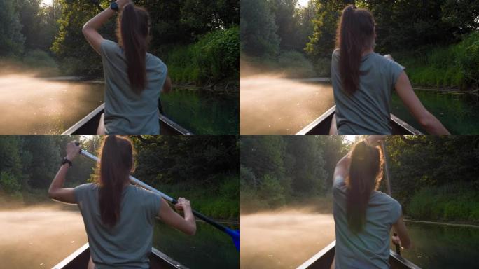 日落时乘独木舟探索雄伟的迷雾河的女人