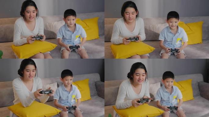 亚洲兄弟少女在家里和哥哥玩游戏机时竞争