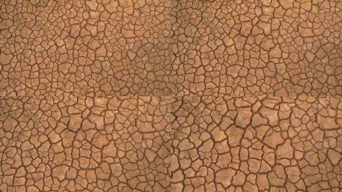 空中自上而下: 长期干旱造成的干燥区域和破裂土壤的视图