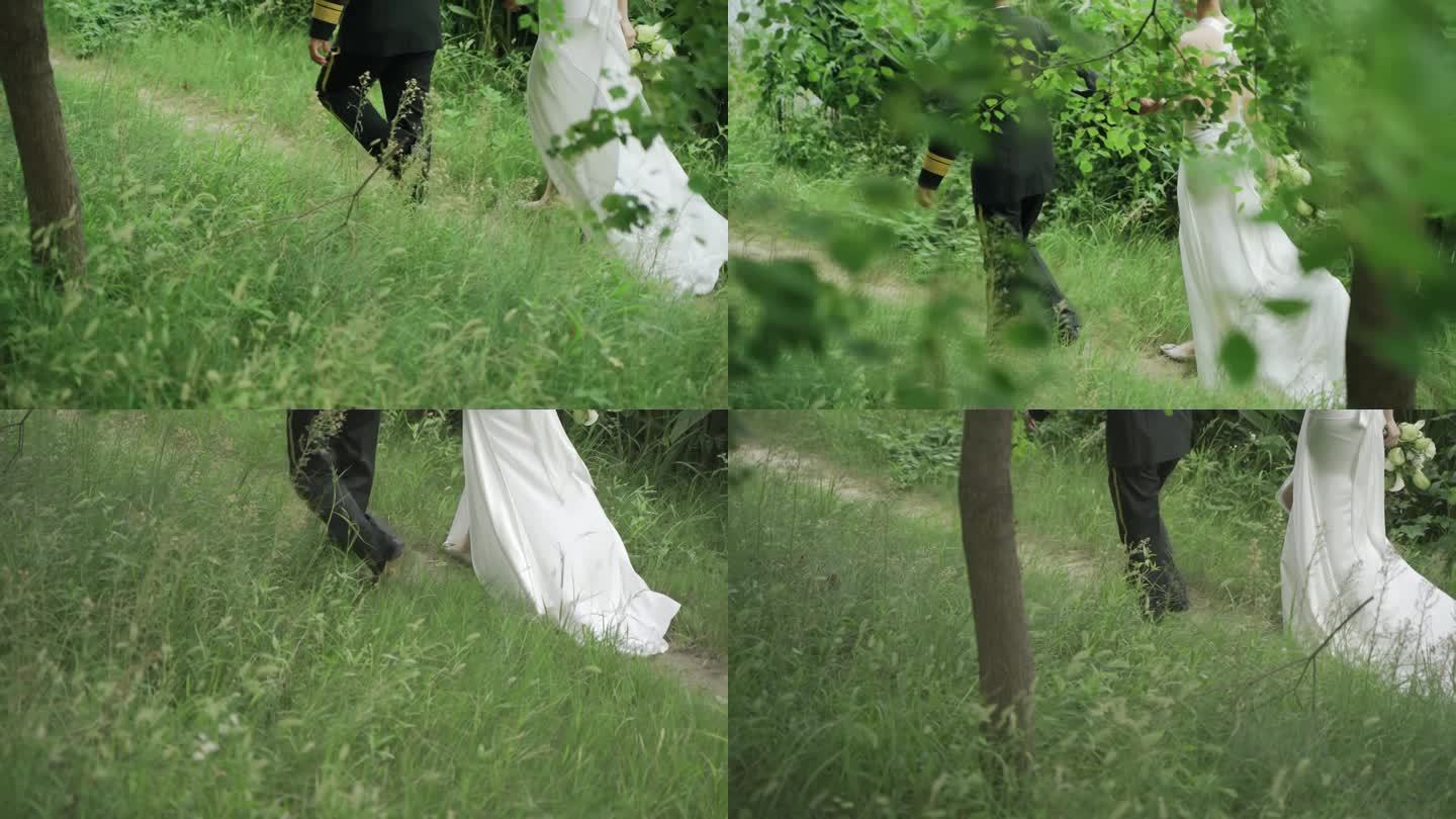 草地上行走的新郎新娘背影脚步
