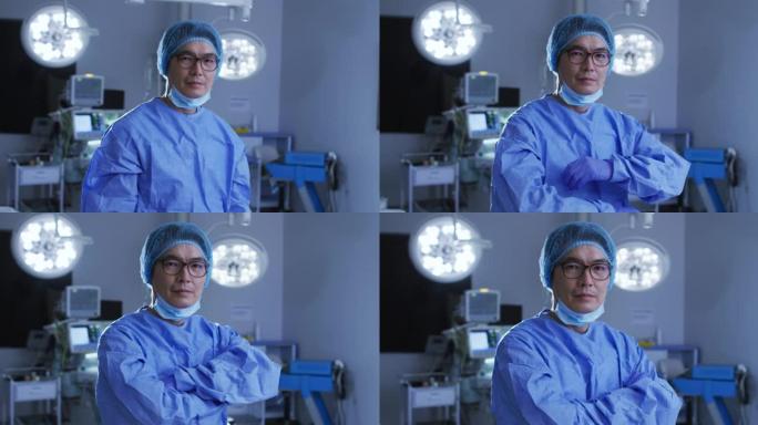 亚洲男外科医生戴着低面罩，在手术室交叉双臂的肖像