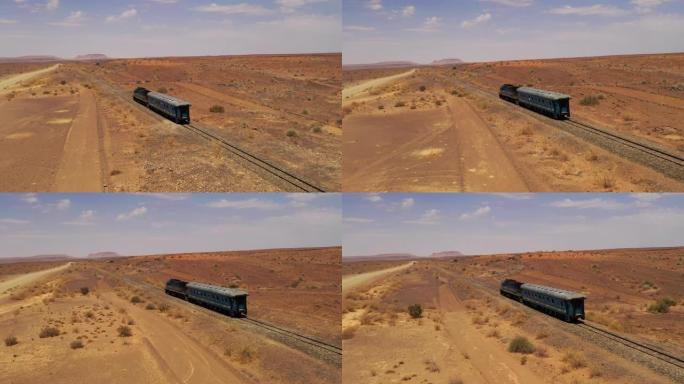 WS火车穿越非洲纳米比亚的阳光明媚的偏远沙漠