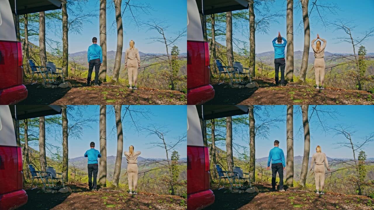 夫妇在早上做冥想锻炼，在大自然的小山上站在一起，面包车停在前面，背景是美丽的风景