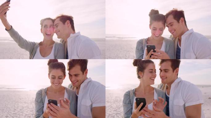 一对年轻夫妇使用智能手机在海滩上自拍的4k视频片段